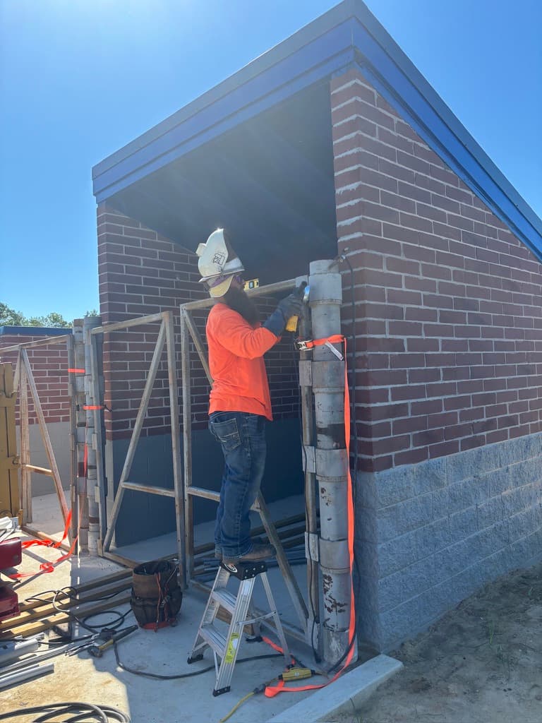 Metal door frame installation on commercial building