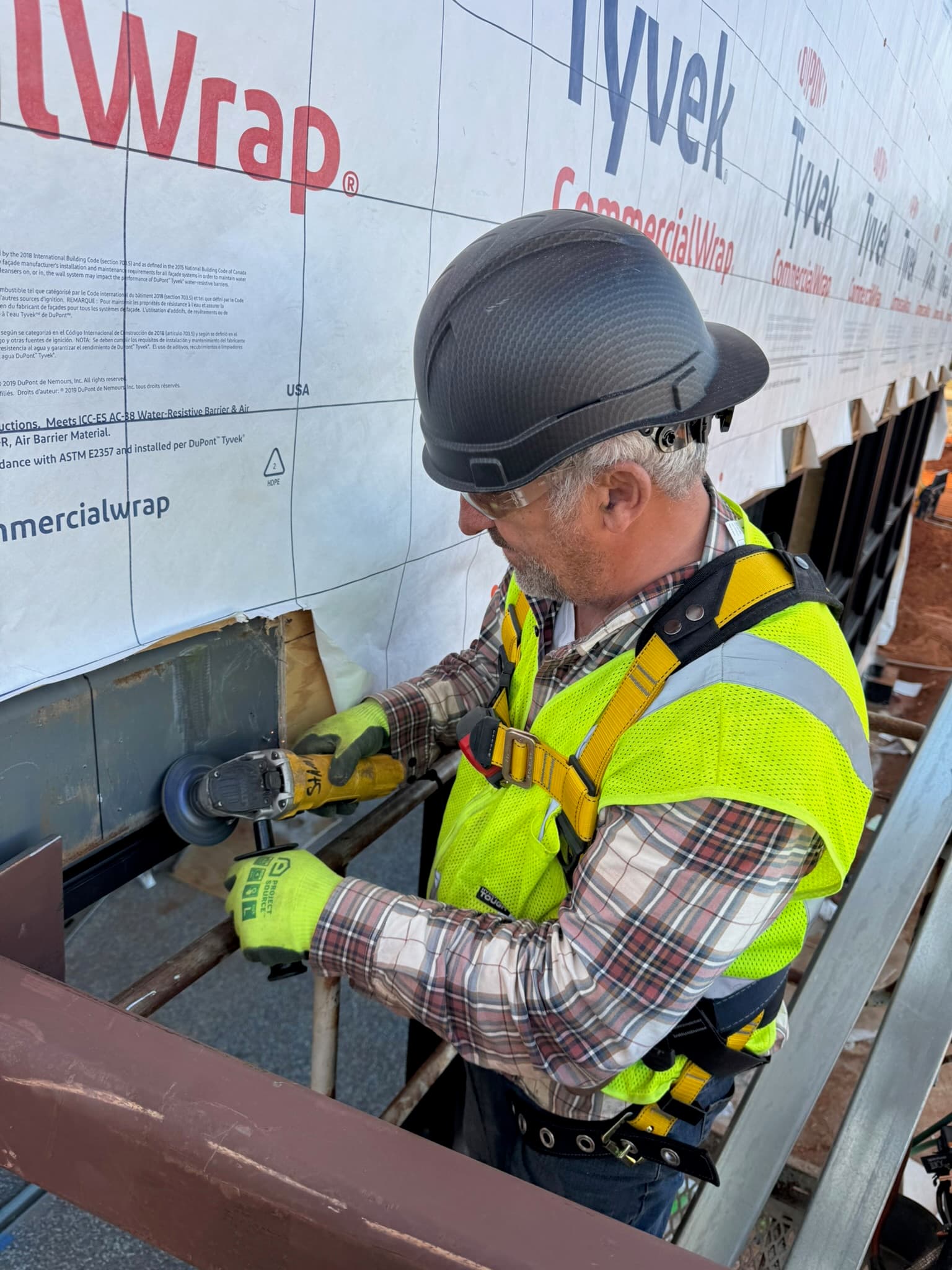 Worker fabricating structural steel